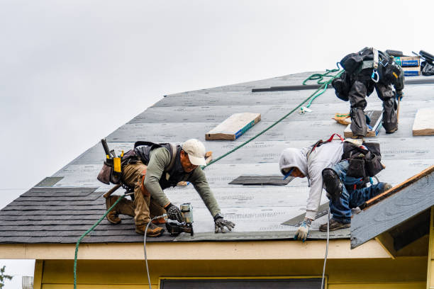 Professional Roof Replacement technician working in Newton Center, MA